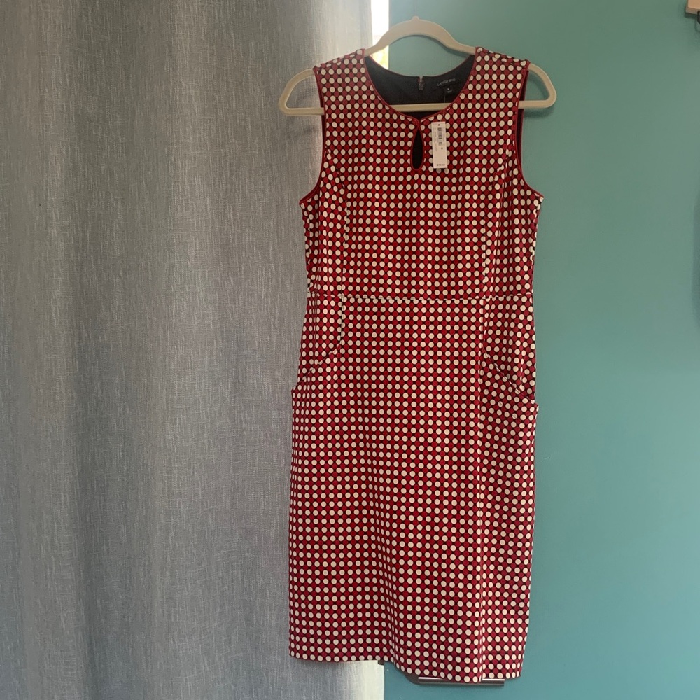 Fitted with stretch Polka dots of red and off white on midnight navy blue midi